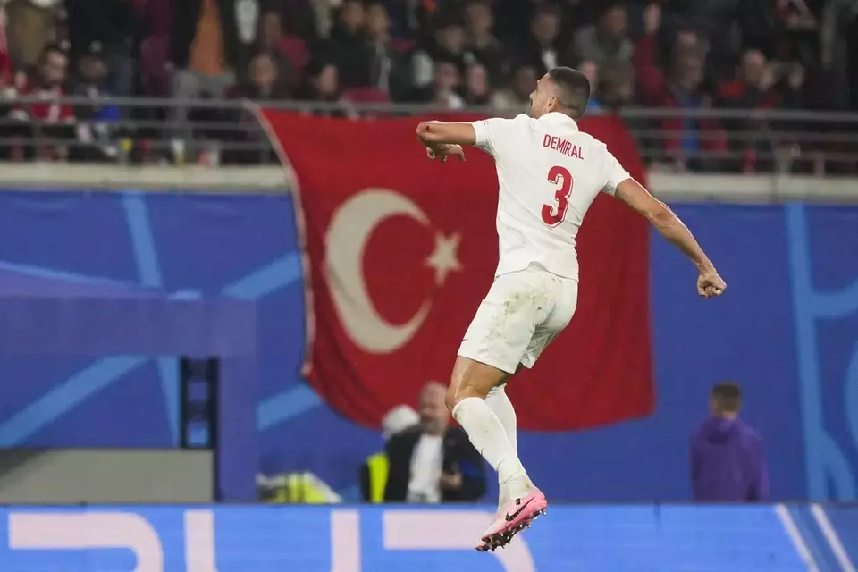 Merih Demiral celebrates after scoring a goal fo Turkey during a round of sixteen match between Austria and Turkey at the Euro 2024 soccer tournament in Leipzig, Germany, Tuesday, July 2, 2024. (AP Photo/Martin Meissner)