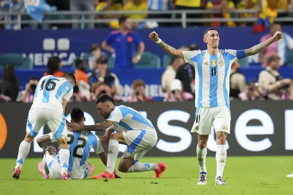 Angel Di Maria celebrates after teammate Lautaro Martinez scored a goal for Argentina during the Copa America final soccer match against Colombia in Miami Gardens, Florida, Sunday, July 14, 2024. (AP Photo/Julio Cortez)
