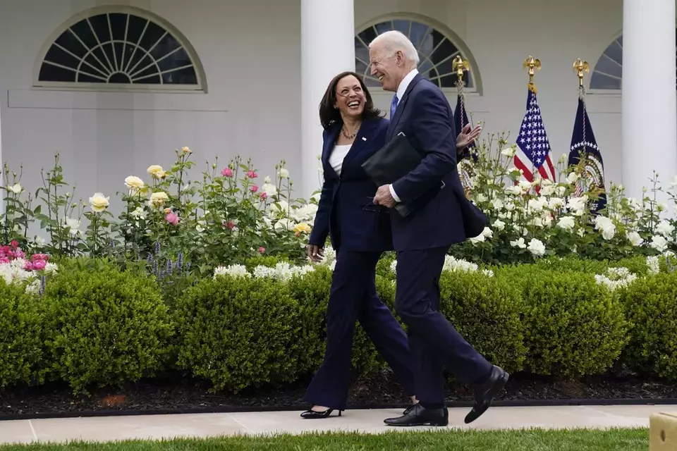 FILE - President Joe Biden walks with Vice President Kamala Harris in the Rose Garden of the White House, May 13, 2021, in Washington. (AP Photo/Evan Vucci)