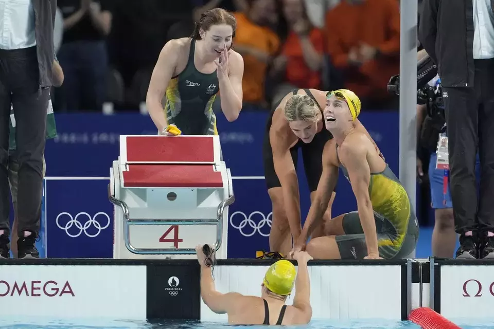 Swimmers from Australia celebrate after winning the women s 4x100-meter freestyle relay final at the 2024 Summer Olympics, Saturday, July 27, 2024, in Nanterre, France. (AP Photo/Matthias Schrader)