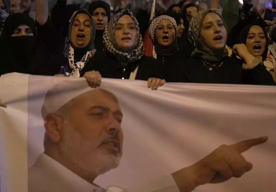 People protest to condemn the killing of Hamas leader Ismail Haniyeh, in Istanbul, Turkey, Wednesday, July 31, 2024. (AP Photo/Khalil Hamra)