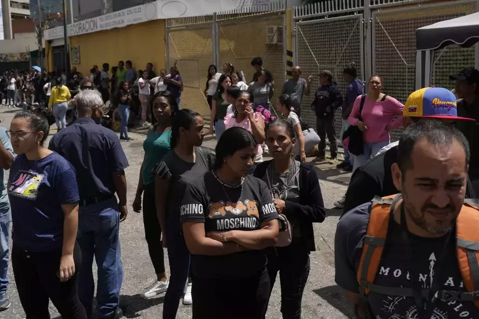 Families of detainees gather outside the Boleita National Police detention center after their loved ones were detained in recent days during opposition protests against the official results of the presidential election in Caracas, Venezuela, Thursday, Aug. 1, 2024. (AP Photo/Matias Delacroix)