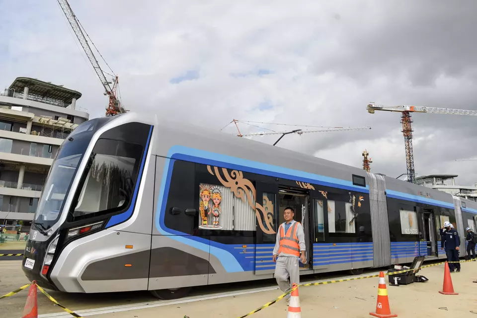 Workers inspect the Autonomous Rail Transit (ART) carriages in Nusantara, East Kalimantan, Monday, Aug. 5, 2024. (Antara Photo/M Risyal Hidayat)