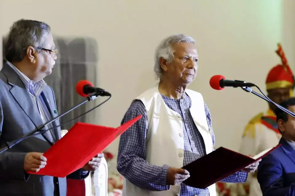 Figurehead President Mohammed Shahabuddin administers the oath of office to Nobel laureate Muhammad Yunus, right, as the head of Bangladesh s interim government, in Dhaka, Bangladesh, Thursday, Aug. 8, 2024. (AP Photo/Rajib Dhar)
