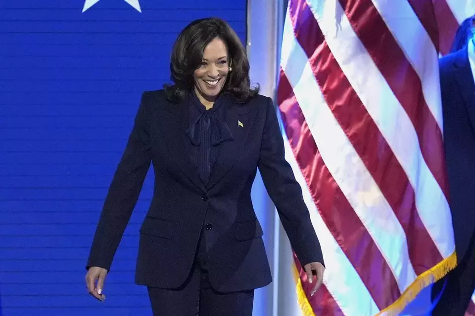 Democratic presidential nominee Vice President Kamala Harris walks on stage to speak during the Democratic National Convention Thursday, Aug. 22, 2024, in Chicago. (AP Photo/J. Scott Applewhite)