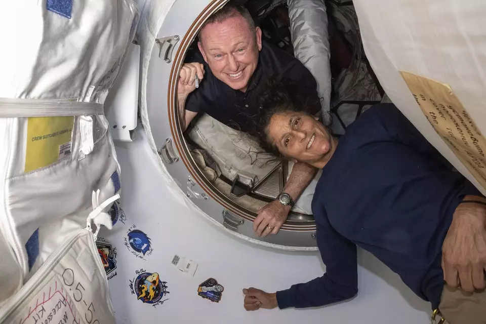 FILE - In this photo provided by NASA, Boeing Crew Flight Test astronauts Butch Wilmore, left, and Suni Williams pose for a portrait inside the vestibule between the forward port on the International Space Station s Harmony module and Boeing s Starliner spacecraft on June 13, 2024. (NASA via AP, File)