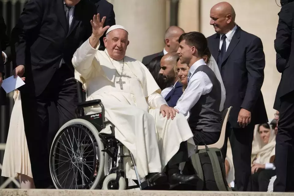 FILE-- Pope Francis waves as he leaves after his weekly general audience in St. Peter s Square at The Vatican, Aug. 28, 2024. (AP Photo/Andrew Medichini, File)
