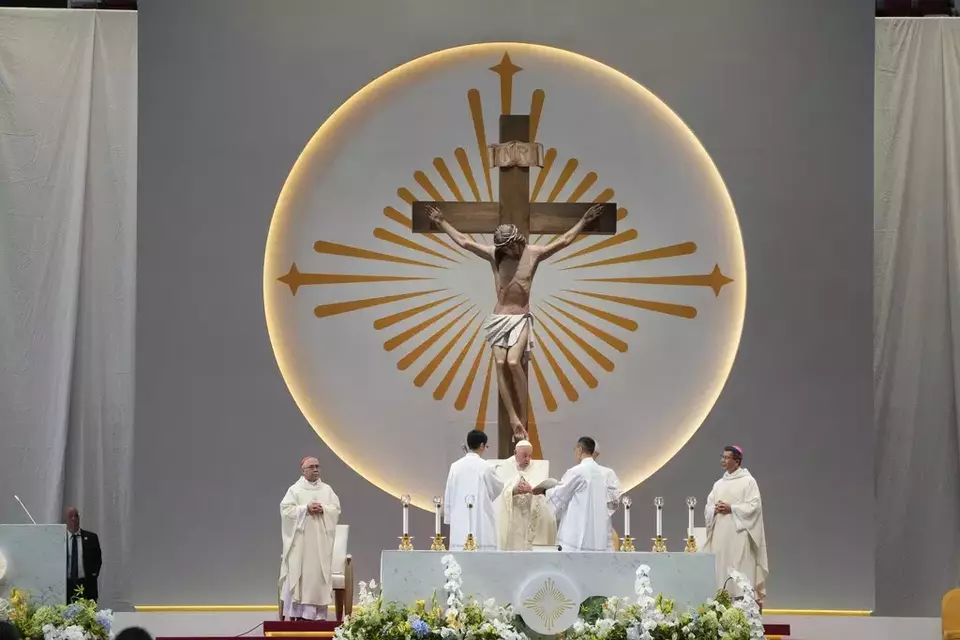 Pope Francis presides over a mass "In Memory of the Most Holy Name of Mary" celebrated by the Archbishop of Singapore, Cardinal William Goh Seng Chye at the Singapore SportsHub National Stadium, Thursday, Sept. 12, 2024. (AP Photo/Gregorio Borgia)
