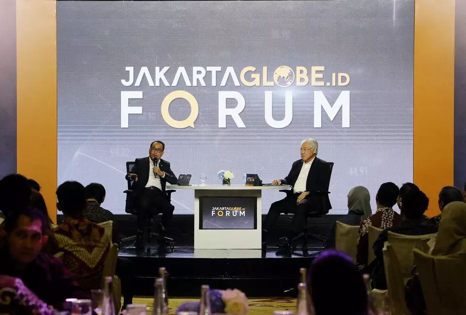 Transportation Minister Budi Karya Sumadi, left, speaks at the Jakarta Globe Forum as host Enggartiasto Lukita looks on at Mulia Hotel in Jakarta, Friday, Sept. 20, 2024. (JG Photo/Joanito De Saojoao)