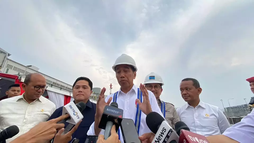 President Joko "Jokowi" Widodo speaks to reporters during the inauguration of Freeport Indonesia