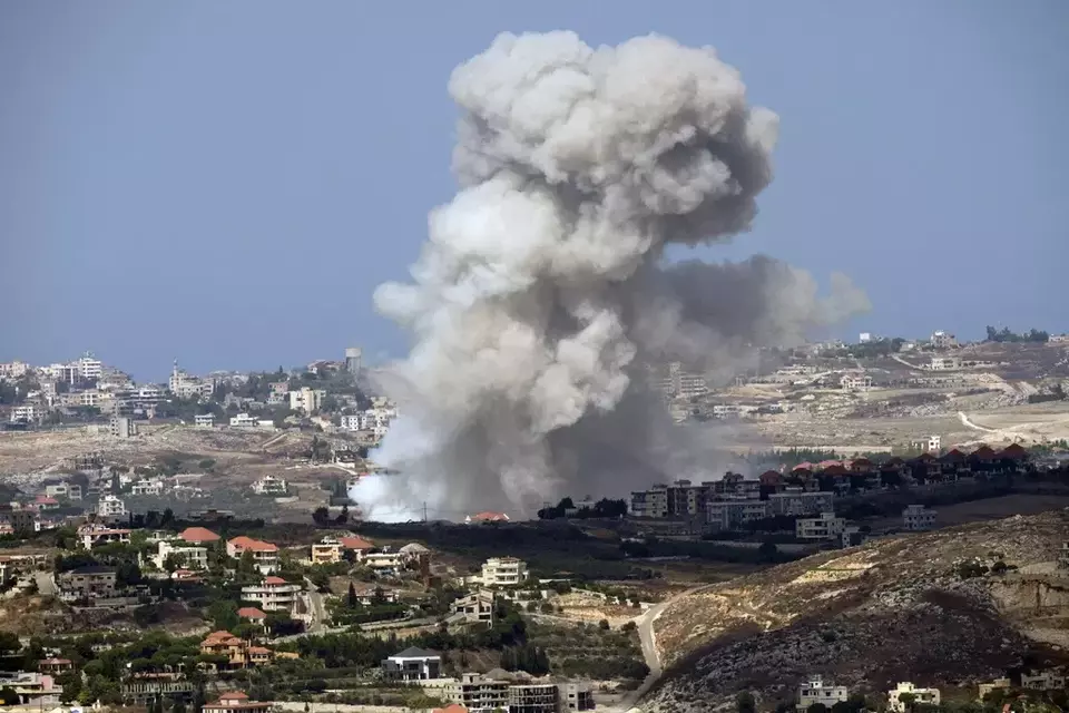 Smoke rises from Israeli shelling on villages in the Nabatiyeh district, seen from the southern town of Marjayoun, Lebanon, Monday, Sept. 23, 2024. (AP Photo/Hussein Malla)