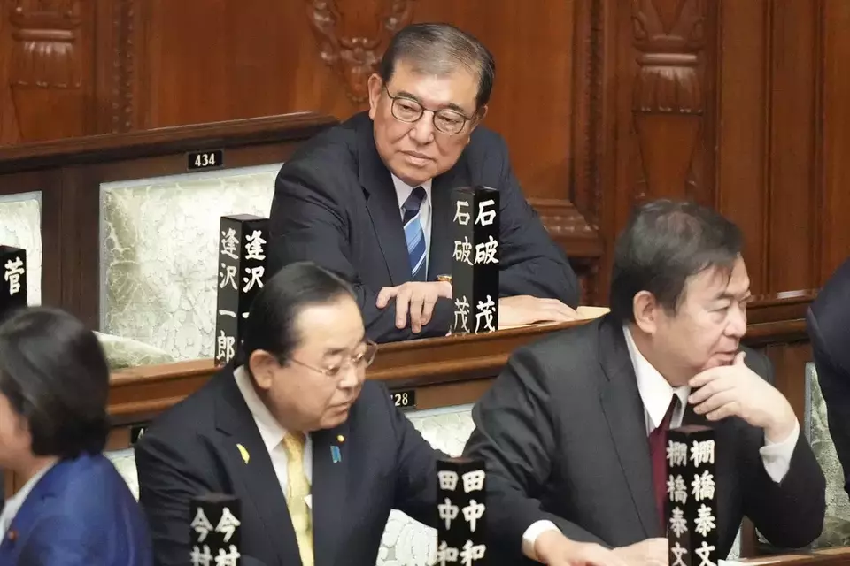 Shigeru Ishiba, top, sits ahead of the extraordinary session of parliament