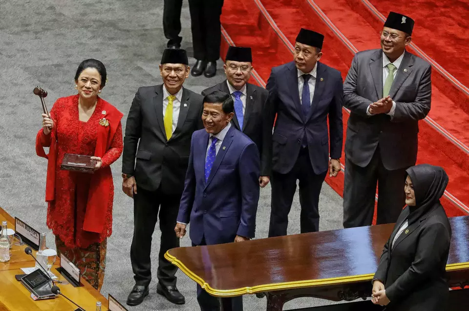 House of Representatives Speaker Puan Maharani, left, shows the gavel after her inauguration at the legislature building in Jakarta, Tuesday, Oct. 1, 2024. (B-Universe Photo/Joanito De Saojoao)