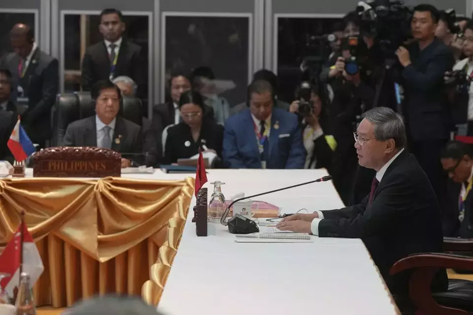 Chinese Premier Li Qiang, right, delivers his opening remarks as Philippine President Ferdinand Marcos Jr., front left, listens during the 27th Association of Southeast Asian Nations (ASEAN)-China Summit in Vientiane, Laos, Thursday, Oct. 10, 2024. (AP Photo/Dita Alangkara)