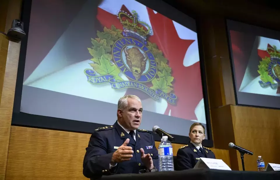 Royal Canadian Mounted Police (RCMP) Commissioner Mike Duheme, left, and Assistant Commissioner Brigitte Gauvin participate in a news conference at RCMP National Headquarters in Ottawa, Ontaio, Monday, Oct. 14, 2024. (Justin Tang/The Canadian Press via AP)
