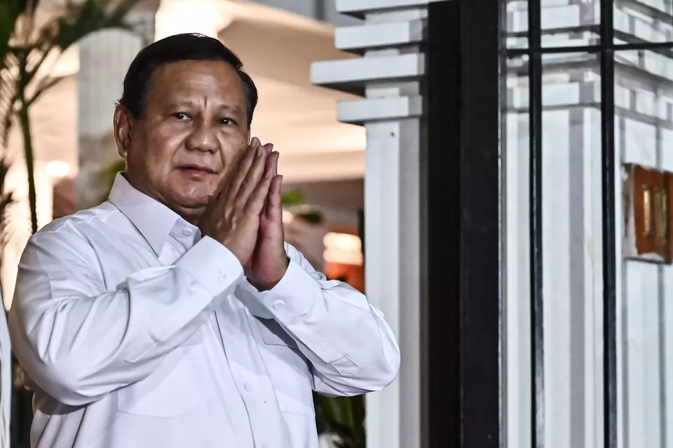 President-elect Prabowo Subianto greets journalists after meeting with several figures at his residence on Kertanegara, South Jakarta, on Monday, Oct. 14, 2024. Prabowo is set to continue summoning candidates for ministerial and deputy minister/head of state agency positions for the new administration on Oct. 15, 2024. (ANTARA FOTO/Aprillio Akbar).