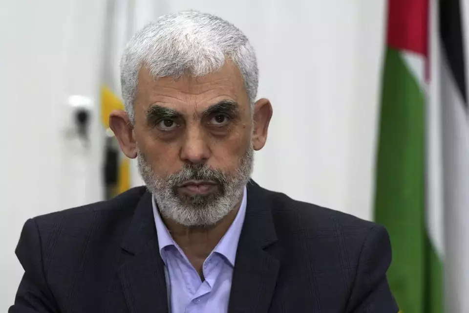 FILE - Yahya Sinwar, head of Hamas in Gaza, chairs a meeting with leaders of Palestinian factions at his office in Gaza City, on April 13, 2022. (AP Photo/Adel Hana)