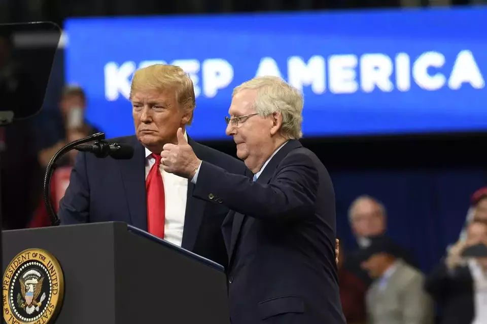 FILE - US President Donald Trump brings Senate Majority Leader Mitch McConnell of Kentucky on stage during a campaign rally in Lexington, Kentucky, Nov. 4, 2019. (AP Photo/Susan Walsh)