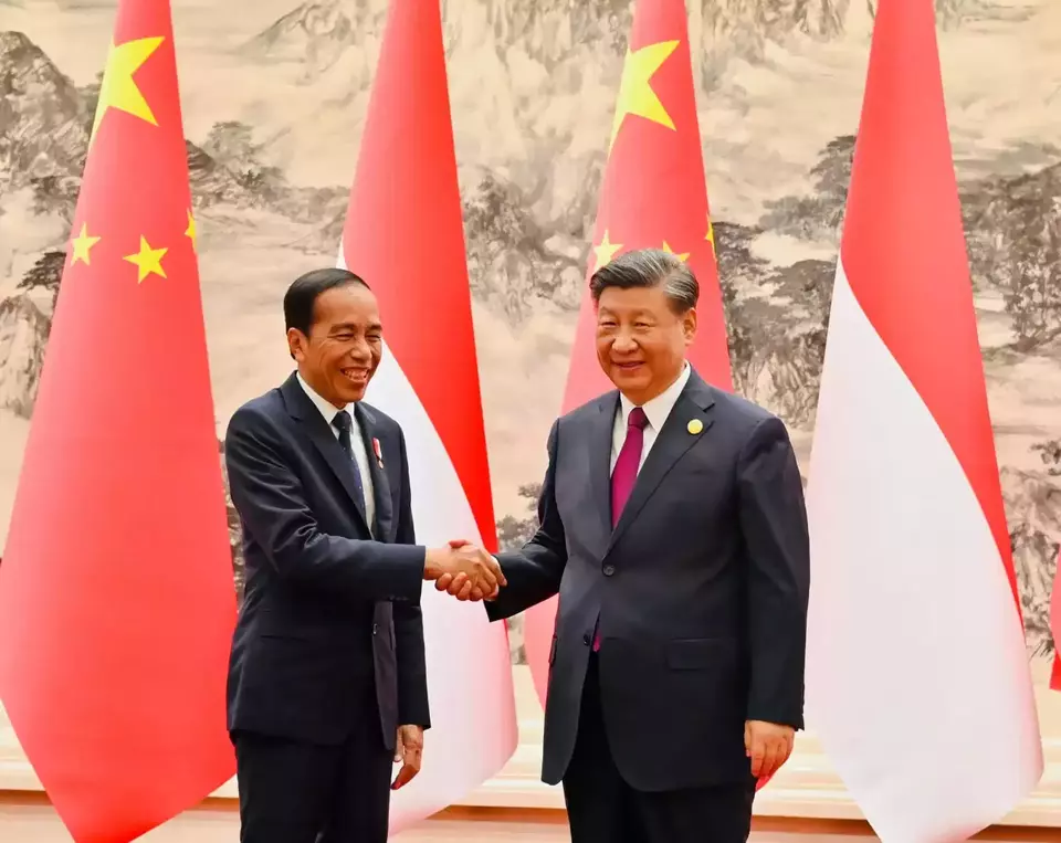 President Joko "Jokowi" Widodo shakes hands with China