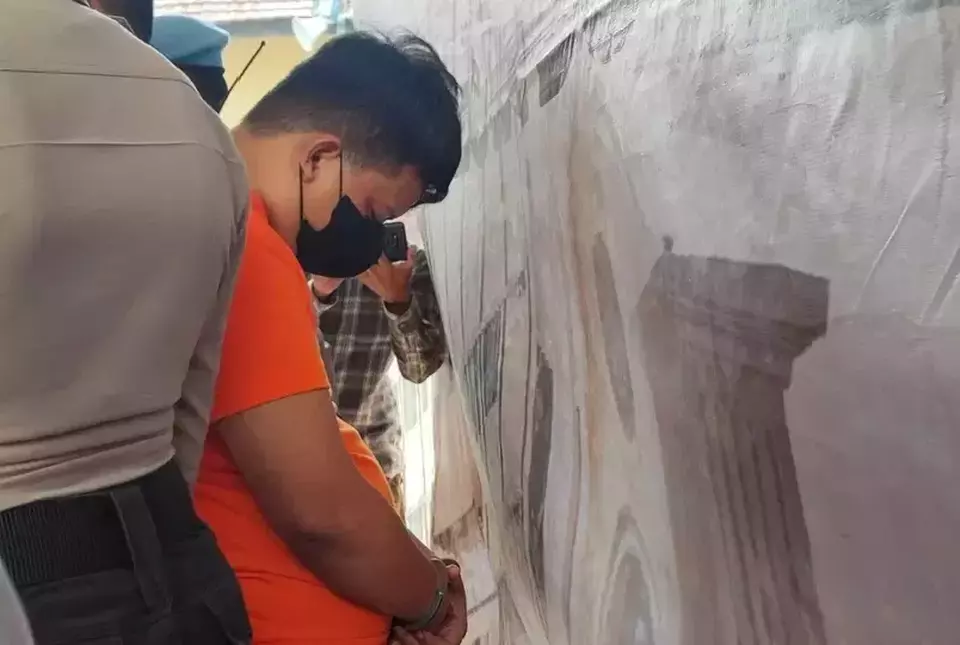 A man identified by the initials SK is arrested in Bogor, West Java, for allegedly building at least 35 gambling websites, Friday, Nov. 8, 2024. (B-Universe Photo/Heru Yustanto)