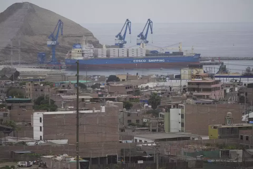 A cargo ship sits in a Chinese-funded port in Chancay, Peru, Tuesday, Nov. 12, 2024. (AP Photo/Silvia Izquierdo)