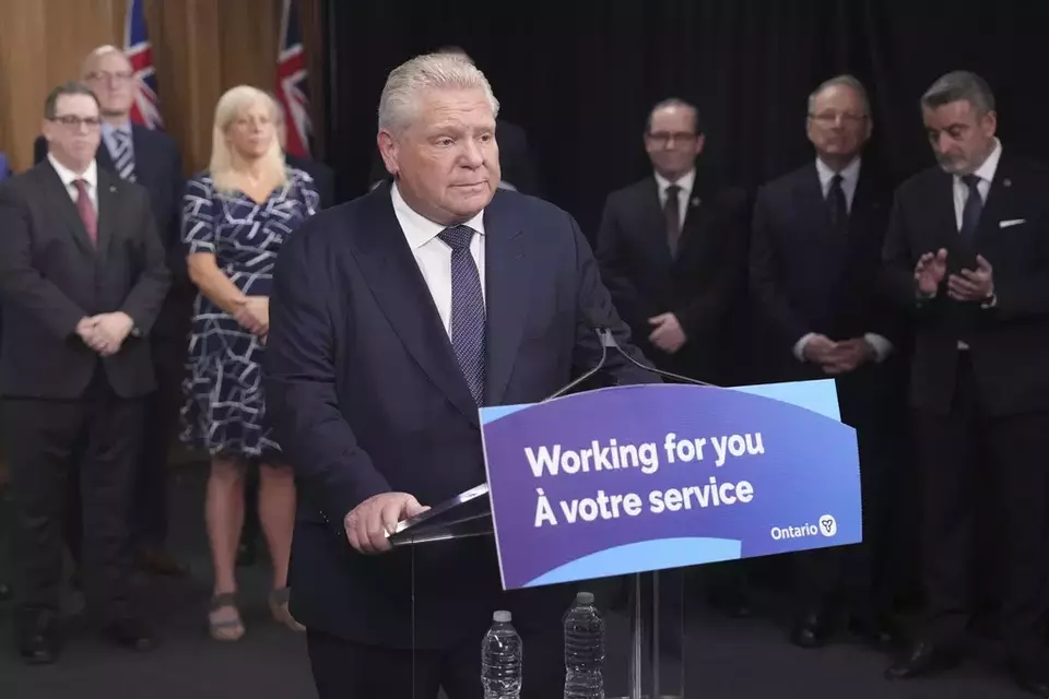 Ontario Premier Doug Ford speaks to members of the media as mayors from selected municipalities and government ministers look on the Queen