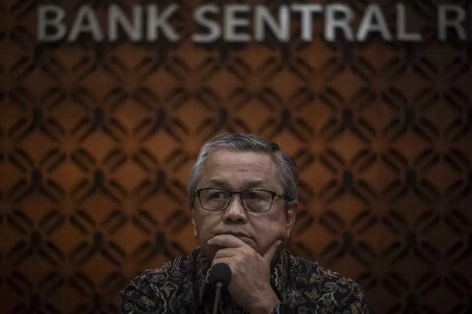 Bank Indonesia Governor Perry Warjiyo listens to questions from journalists during a news conference at the central bank headquarters in Central Jakarta, Wednesday, Dec. 18, 2024. (Antara Photo/Aprillio Akbar)