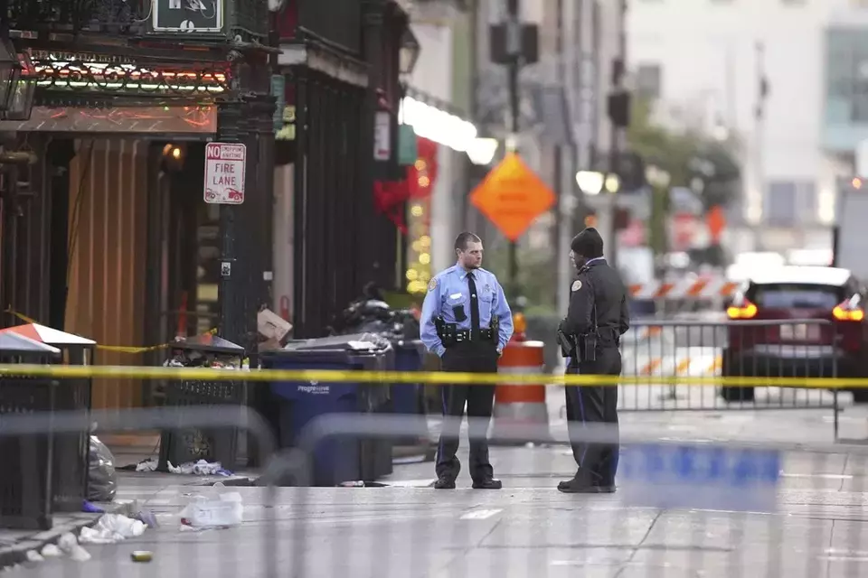 Emergency services attend the scene on Bourbon Street after a vehicle drove into a crowd on Canal and Bourbon Street, New Orleans, Wednesday Jan. 1, 2025. (AP Photo/Gerald Herbert)