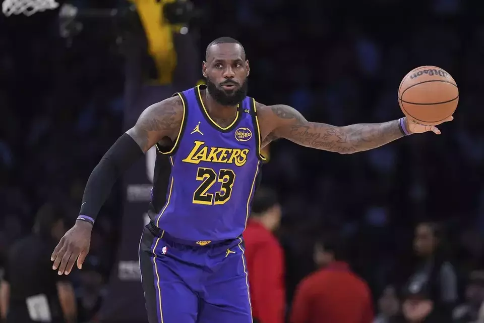 Los Angeles Lakers forward LeBron James takes a pass during the first half of an NBA basketball game against the Atlanta Hawks, Friday, Jan. 3, 2025, in Los Angeles. (AP Photo/Mark J. Terrill)