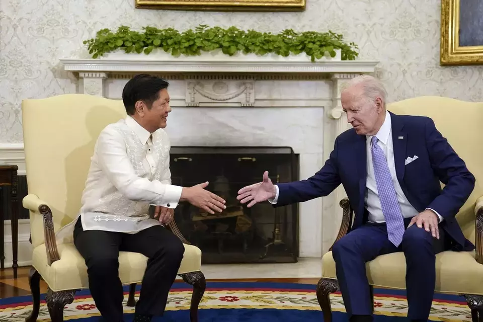 FILE - US President Joe Biden, right, shakes hands with Philippines President Ferdinand Marcos Jr. as they meet in the Oval Office of the White House in Washington, on May 1, 2023. (AP Photo/Carolyn Kaster, File)