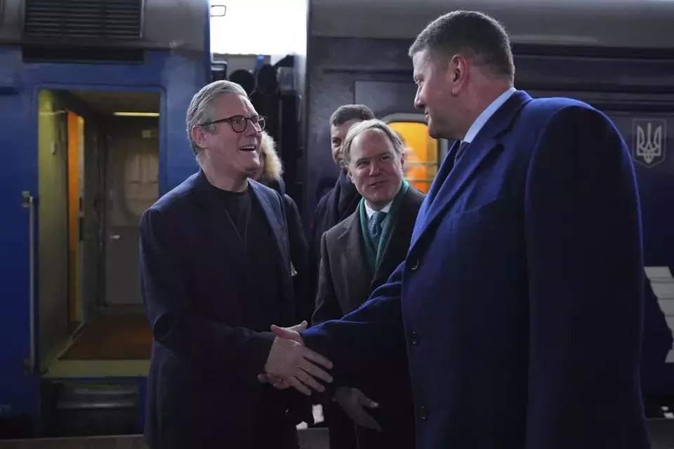 British Prime Minister Keir Starmer, left, is greeted by Ukrainian officials and the British ambassador to Ukraine Martin Harris, second right, as he arrives at a train station in Kyiv, Ukraine Thursday, Jan. 16, 2025. (Carl Court/Pool Photo via AP)
