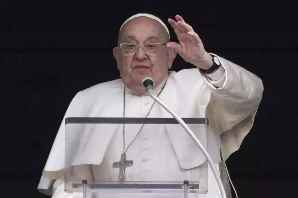 Pope Francis delivers his blessing as he recites the Angelus noon prayer from the window of his studio overlooking St. Peter s Square, at the Vatican, Sunday, Jan. 19, 2025. (AP Photo/Andrew Medichini)