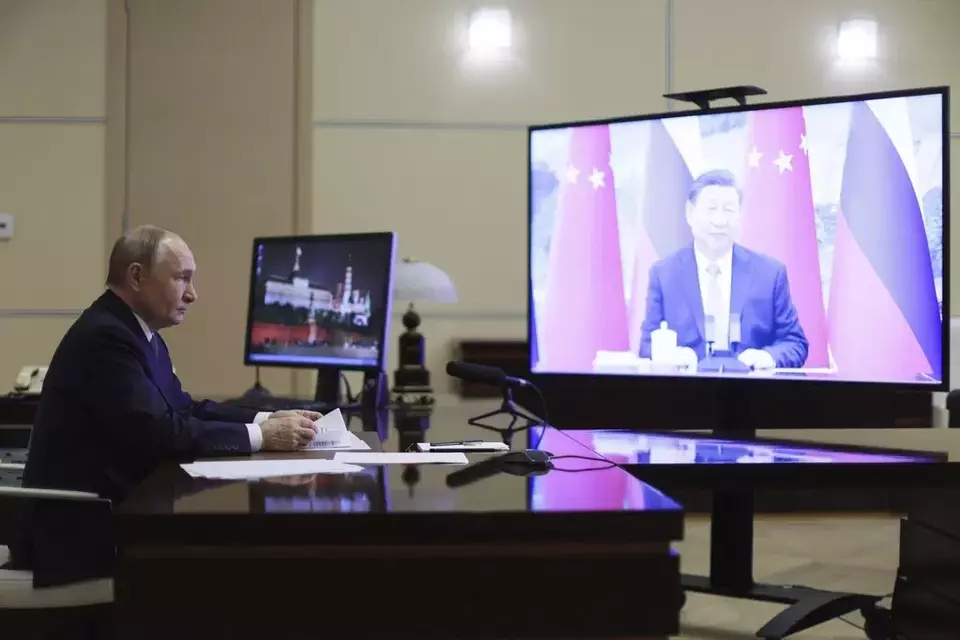 Russian President Vladimir Putin speaks with Chinese President Xi Jinping via videoconference at Novo-Ogaryovo state residence outside of Moscow, Russia, Tuesday, Jan. 21, 2025. (Gavriil Grigorov, Sputnik, Kremlin Pool Photo via AP)