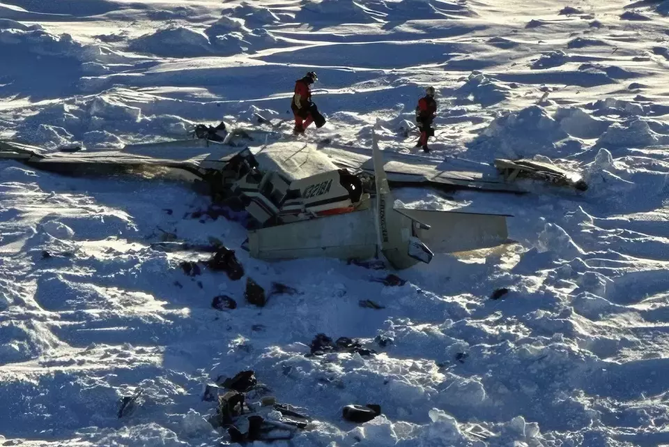 This photo provided by the US Coast Guard on Friday, Feb. 7, 2025, shows a small commuter plane that crashed in western Alaska on a flight that was bound for the hub community of Nome. (US Coast Guard via AP)