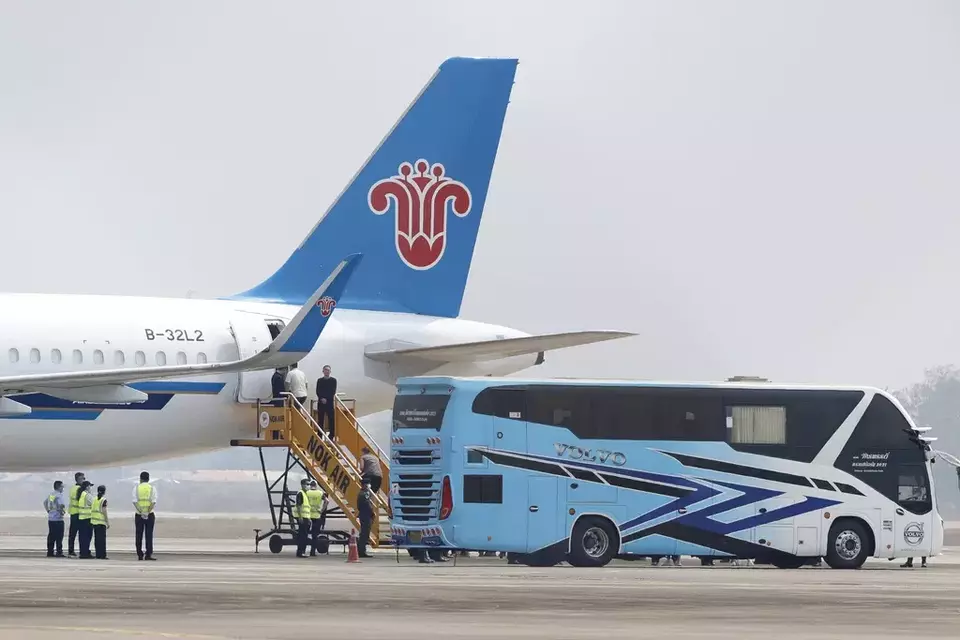 Chinese nationals, believed to have worked at scam centers in eastern Myanmar, board a plane at Thailand's Mae Sot International Airport before being sent back to China on Thursday, Feb. 20, 2025. (AP Photo/Sarot Meksophawannakul)