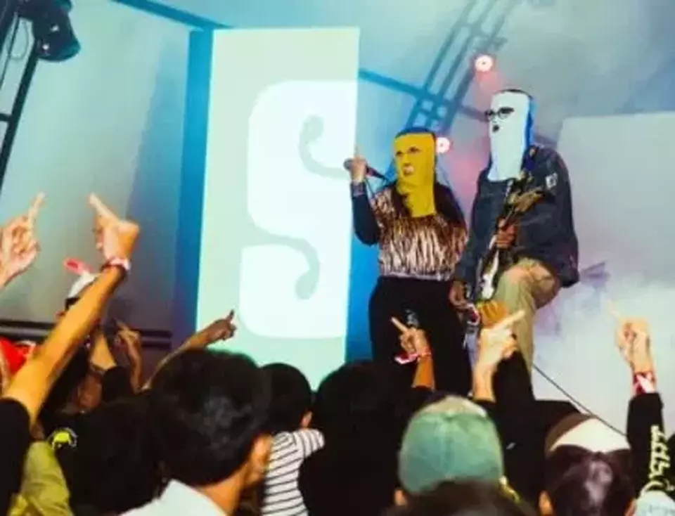 Sukatani performs at Bukit Pintar, Subang, West Java, in December 2024. Band members Syifa Al Lufti (Alectroguy) and Novi Citra (Twister Angel) later issued a public apology for their song Bayar Bayar Bayar, which criticized alleged police extortion. (Instagram @sukataniband)