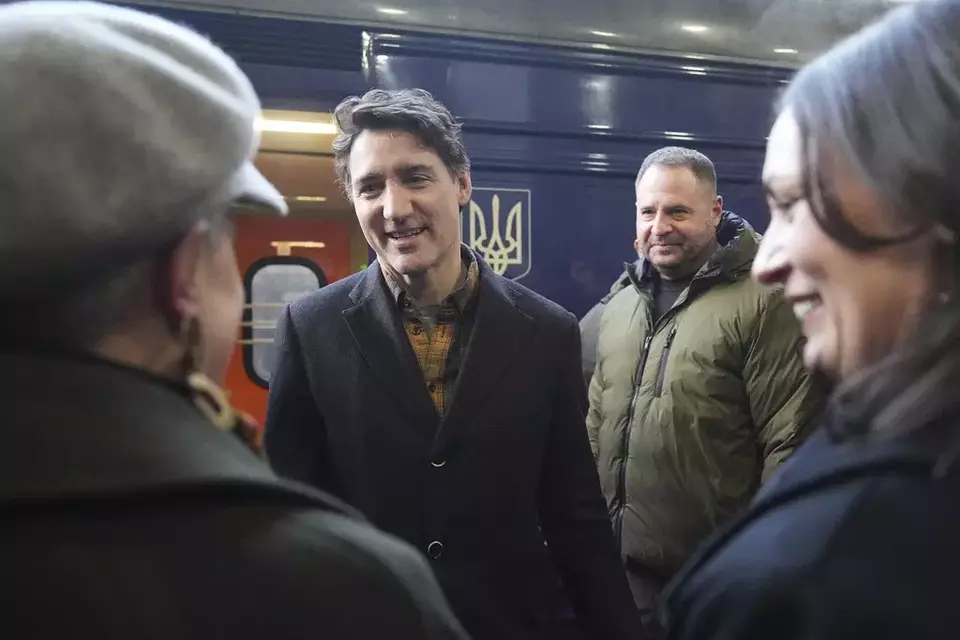 Canada's Prime Minister Justin Trudeau arrives at a train station on the third anniversary of the Russian invasion of Ukraine, Kyiv, Ukraine, Monday, Feb. 24, 2025. (AP Photo/Efrem Lukatsky)