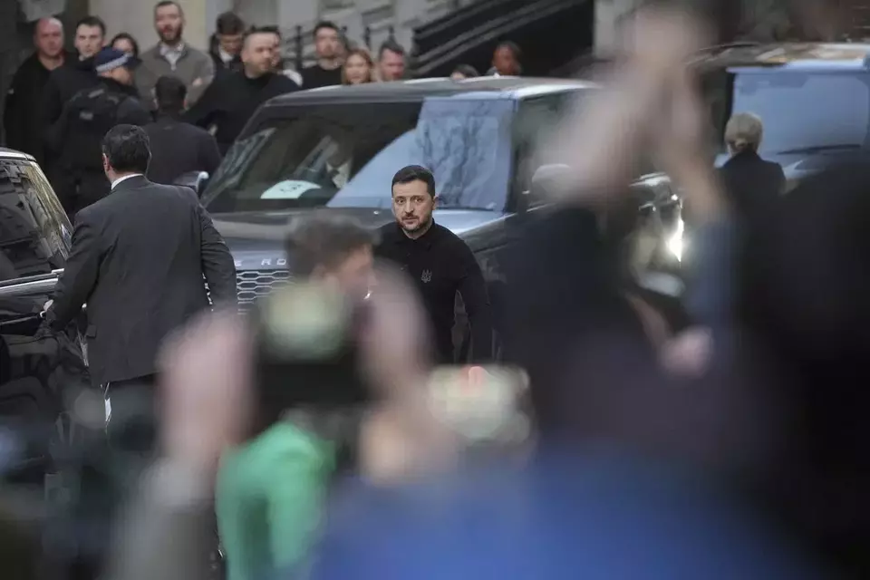 Ukraine's President Volodymyr Zelensky looks towards the waiting media as he arrives in Downing Street for a meeting with Britain's Prime Minister Keir Starmer in London, Saturday, March 1, 2025. (AP Photo/Kin Cheung)