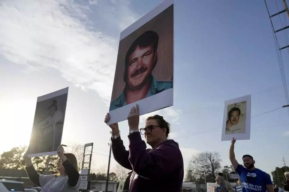 Protestors demonstrate outside the scheduled execution of South Carolina inmate Brad Sigmon, Friday, March 7, 2025, in Columbia, S.C. (AP Photo/Chris Carlson)