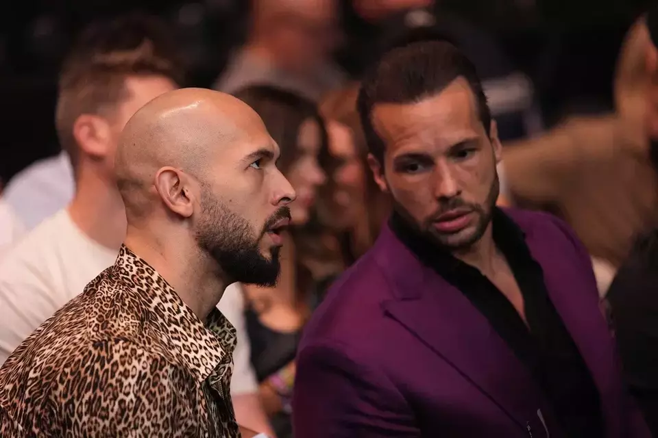 Andrew Tate, left, and Tristan Tate attend a UFC 313 mixed martial arts event on Saturday, March 8, 2025, in Las Vegas. (AP Photo/John Locher)