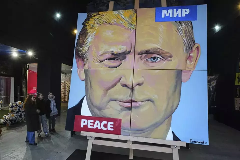 'Peace to the world', a painting created by Russian artist Alexei Sergienko showing a combination of faces of Russian President Vladimir Putin and US President Donald Trump, is on display at the Sergienko's gallery in St. Petersburg, Russia, Friday, March 14, 2025. (AP Photo/Dmitri Lovetsky)