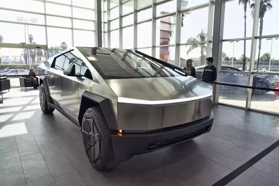 A Tesla Cybertruck is on display at the Tesla showroom in Buena Park, Calif., Dec. 3, 2023. (AP Photo/Richard Vogel)