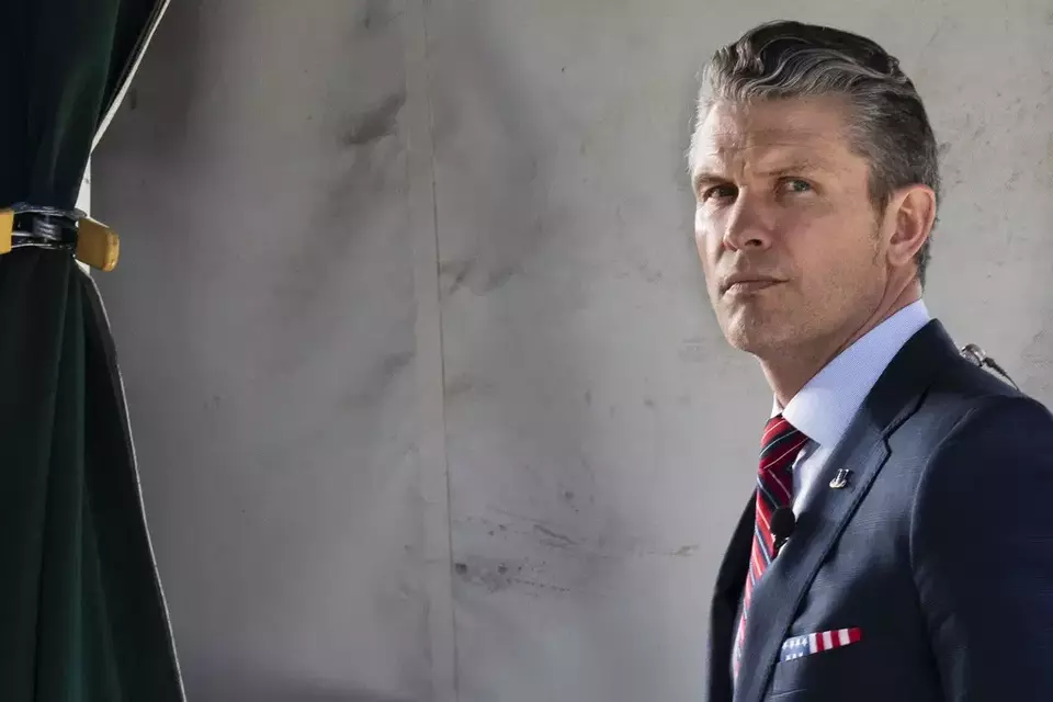 Defense Secretary Pete Hegseth does a television interview outside the White House, Friday, March 21, 2025, in Washington. (AP Photo/Jacquelyn Martin)