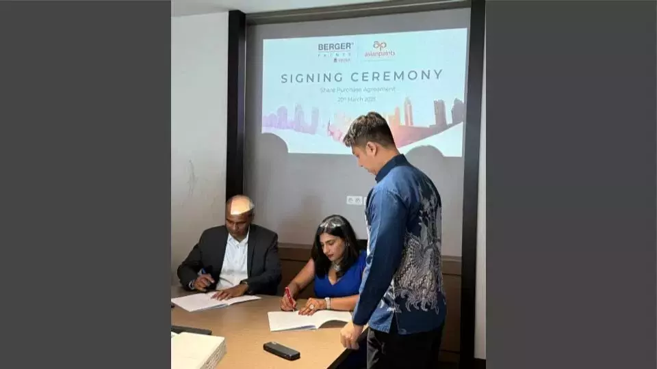 The signing of the share purchase agreement document by Namrata Shetty, Director Berger Paints Singapore and Pragyan Kumar, CEO Asian Paints International Pvt Ltd in Jakarta, Indonesia. (Photo Courtesy of Asian Paints)