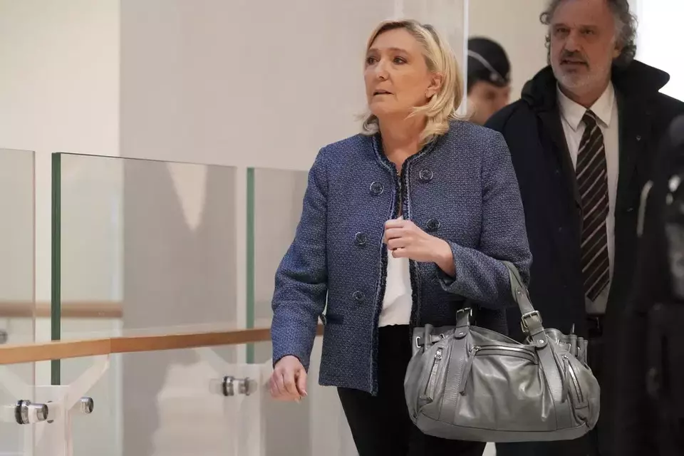 French far-right leader Marine Le Pen arrives at a Paris court expected to deliver a verdict in an embezzlement case that could shake up French politics and derail her career Monday, March 31, ,2025 in Paris. (AP Photo/Thibault Camus)