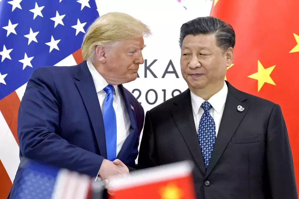 US President Donald Trump shakes hands with his Chinese counterpart Xi Jinping during a meeting on the sidelines of the G20 Summit in Osaka, Japan, on June 29, 2019. (AP Photo/Susan Walsh, File)