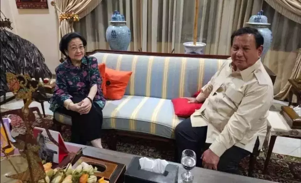 In this photo provided by Gerindra Party, Indonesian Democratic Party of Struggle (PDI-P) Chairwoman Megawati Soekarnoputri receives a visit by President Prabowo Subianto at her private residence in Menteng, Central Jakarta, Monday, April 7, 2025.