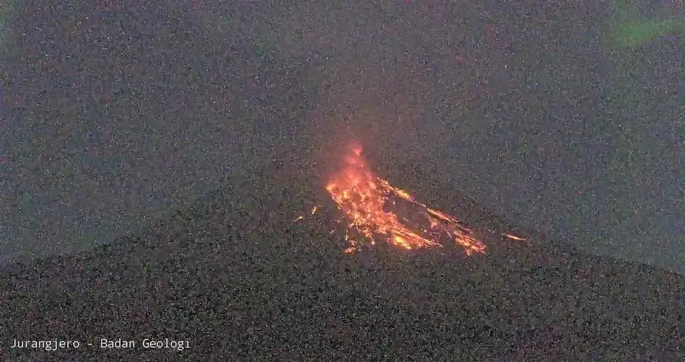 Lava spews from Mount Merapi on the Yogyakarta-Central Java border, Saturday, April 12, 2025. The volcano records 13 lava avalanches as alert level remains high. (Beritasatu.com/ Joko Laksono)