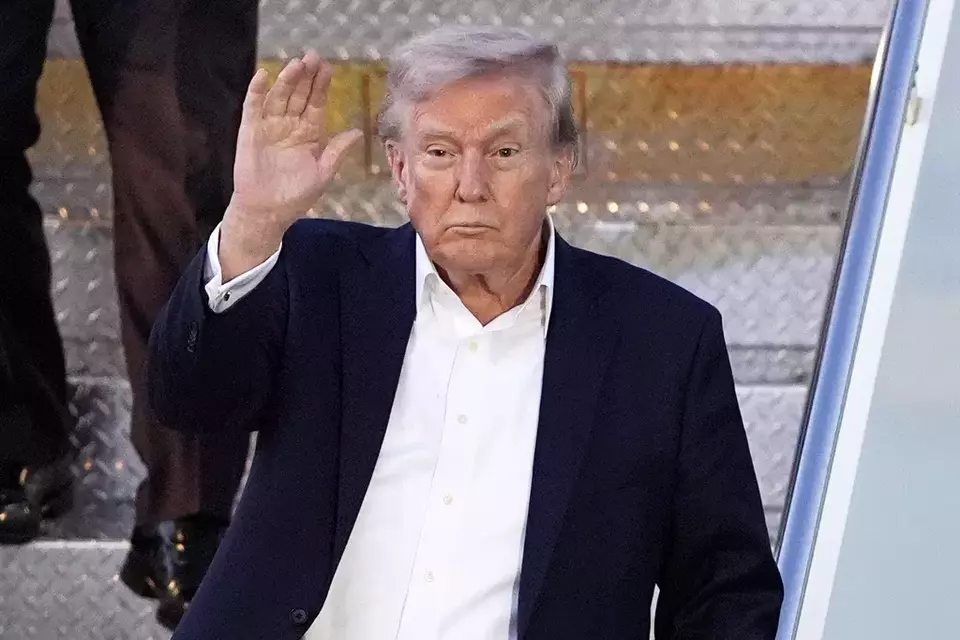 President Donald Trump arrives at Palm Beach International Airport, Friday, April 11, 2025, in West Palm Beach, Fla. (AP Photo/Manuel Balce Ceneta)