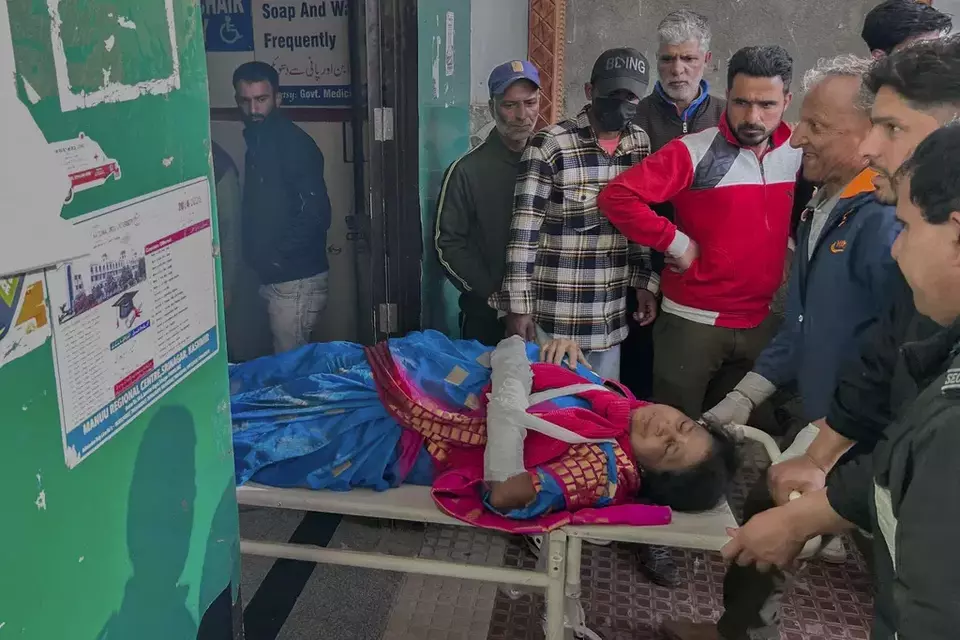 Paramedics carry a wounded tourist on a stretcher at a hospital in Anantnag after assailants indiscriminately fired at tourists visiting Pahalgam, Indian controlled Kashmir, Tuesday, April 22, 2025.(AP Photo/Dar Yasin)